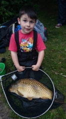 Young superstar Callum Heath with a 10lb common,part of a 24lb catch that put him in 3rd place on the junior match fished at Skilts pool on Sunday 15th June 14.